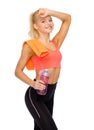 Smiling sporty woman with towel and water bottle Royalty Free Stock Photo