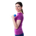 Smiling sporty woman in violet T-short over white isolated background Royalty Free Stock Photo