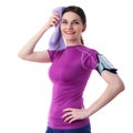 Smiling sporty woman in violet T-short over white isolated background Royalty Free Stock Photo