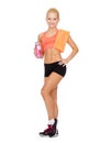 Smiling sporty woman with water bottle and towel Royalty Free Stock Photo