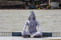 Smiling statue of shiva on the banks of the Ganges in Rishikesh