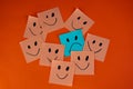 Smiling sticky notes and one sad sticky note. Royalty Free Stock Photo