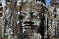 Smiling stone face at east gate of Bayon Temple in Cambodia Royalty Free Stock Photo