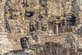 Smiling stone faces of the Bayon temple in Angkor Thom in Cambodia Royalty Free Stock Photo