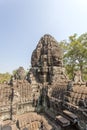 Smiling stone faces tower, Bayon Temple, Angkor Thom, Siem Reap, Cambodia. Royalty Free Stock Photo