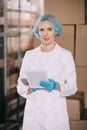 Smiling storekeeper in hairnet looking at Royalty Free Stock Photo