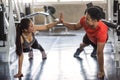 Asian couple push up and high five in fitness gym Royalty Free Stock Photo