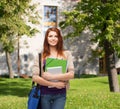 Smiling student with bag, folders and tablet pc Royalty Free Stock Photo