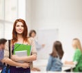 Smiling student with bag, folders and tablet pc Royalty Free Stock Photo