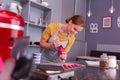 Smiling student of cookery school feeling happy after achieving result