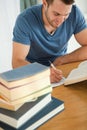 Smiling student doing book report