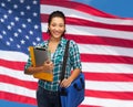 Smiling student with folders, tablet pc and bag Royalty Free Stock Photo