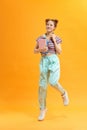 Smiling student girl with books jumping Royalty Free Stock Photo