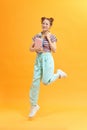 Smiling student girl with books jumping Royalty Free Stock Photo