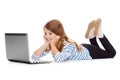 Smiling student girl with laptop computer lying Royalty Free Stock Photo