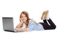 Smiling student girl with laptop computer lying Royalty Free Stock Photo