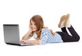 Smiling student girl with laptop computer lying Royalty Free Stock Photo