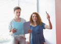 Smiling student holding notebook and pen Royalty Free Stock Photo