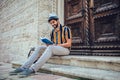 Student reading a book outdoor, studying and preparing for exams at the university or college Royalty Free Stock Photo