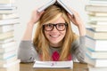 Smiling student teenager holding book over head