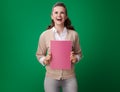 Smiling student woman with pink notebook with pink notebook Royalty Free Stock Photo