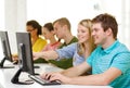 Smiling students in computer class at school Royalty Free Stock Photo
