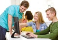 Smiling students in computer class at school Royalty Free Stock Photo