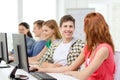 Smiling students in computer class at school Royalty Free Stock Photo