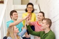 Smiling students making high five gesture sitting Royalty Free Stock Photo