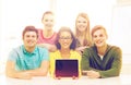Smiling students showing tablet pc blank screen Royalty Free Stock Photo