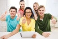 Smiling students with tablet pc computer at school Royalty Free Stock Photo