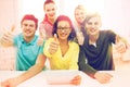 Smiling students with tablet pc computer at school Royalty Free Stock Photo