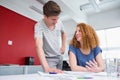 Smiling students working and taking notes together Royalty Free Stock Photo