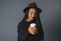 smiling stylish african american girl holding disposable coffee cup Royalty Free Stock Photo