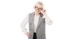 Smiling stylish senior businesswoman looking over eyeglasses