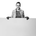 Smiling stylish woman on white showing blank board Royalty Free Stock Photo