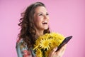 Smiling stylish woman using phone applications on pink Royalty Free Stock Photo