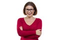 Smiling successful confident middle-aged woman in glasses with folded hands looking at camera on white background, isolated Royalty Free Stock Photo