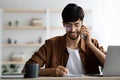 Smiling successful middle eastern man talking on phone Royalty Free Stock Photo