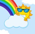 Smiling Summer Sun Mascot Cartoon Character With Sunglasses Hiding Behind Cloud With Rainbow. Royalty Free Stock Photo