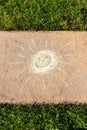 Smiling sunshine drawn with chalk on a sidewalk Royalty Free Stock Photo