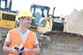 Smiling supervisor looking away at construction site Royalty Free Stock Photo