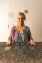 Smiling tarot reader looking at the camera and about to read the cards Royalty Free Stock Photo