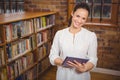 Smiling teacher holding a tablet in her hands Royalty Free Stock Photo