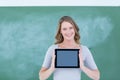 Smiling teacher holding tablet pc Royalty Free Stock Photo