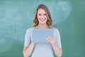 Smiling teacher holding tablet pc Royalty Free Stock Photo