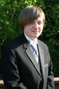 Smiling Teen Boy In Black Tuxedo Vertical