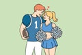 Smiling teen couple in sport uniform