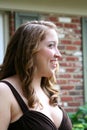 Smiling Teen Girl In Brown Gown Royalty Free Stock Photo