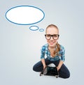 Smiling teen girl sitting on floor with tablet pc Royalty Free Stock Photo